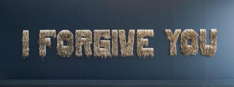 Bindi Cole, Wathaurung people, I forgive you (installation view), 2012. Emu feathers on MDF board, 11 pieces: 100 x 800cm (installed, approx.). Purchased 2012. Queensland Art Gallery Foundation. Collection: Queensland Art Gallery. Photograph: Natasha Harth, QAGOMA. © Bindi Cole Chocka/Licensed by Viscopy, 2014.