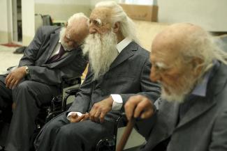 Sun Yuan and Peng Yu, Old Persons Home, 2007. Installation, life-size sculptures, electric wheelchairs, fiberglass, silica gel. Courtesy the artists. 