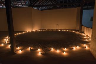 Mona Hatoum, Undercurrent, 2004. Cloth covered electric cable, light bulbs, computerised dimmer unit, diameter 31.16ft. Installation view, Kochi-Muziris Biennale. Courtesy of the artist and the Kochi-Muziris Biennale.